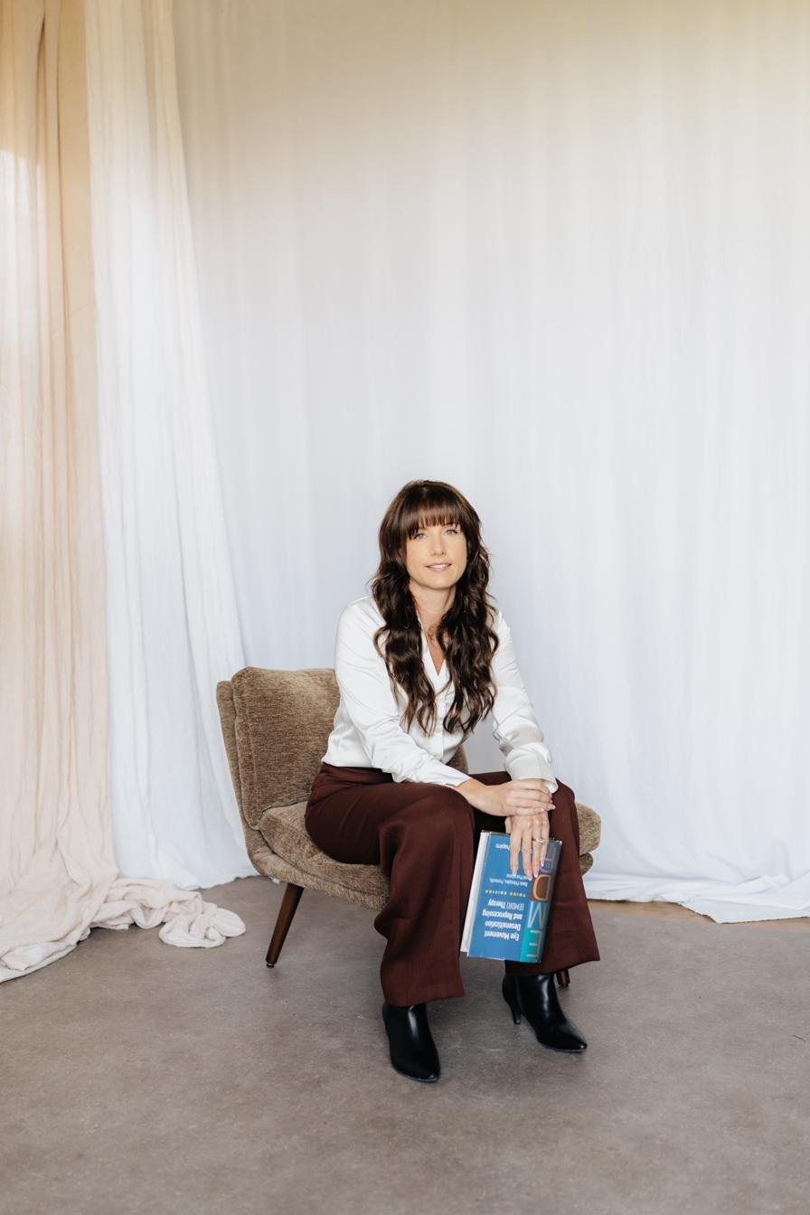 Angelique Vasilaros, MSW, RSW, seated and smiling
